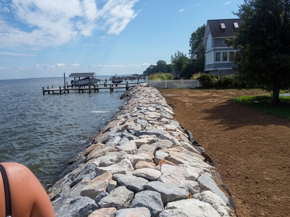 After: Chesapeake Bay Stone Reinforcement — the finished revetment along a new lawn bed.